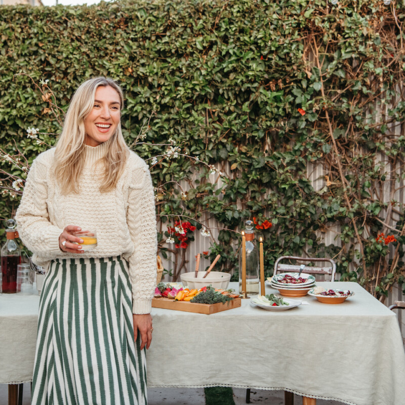 olivia muniak at home, dinner party hostess, backyard dinner party, laughing