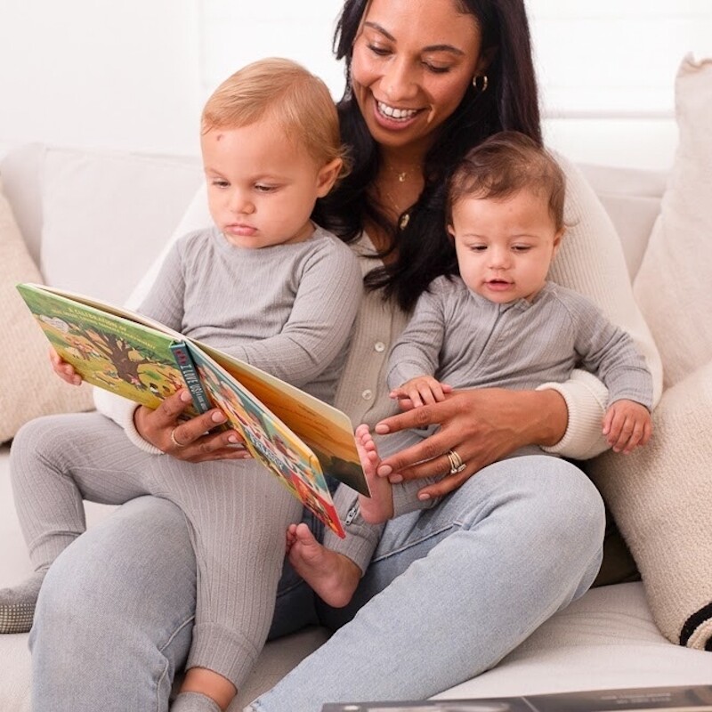 Mother reading to children.