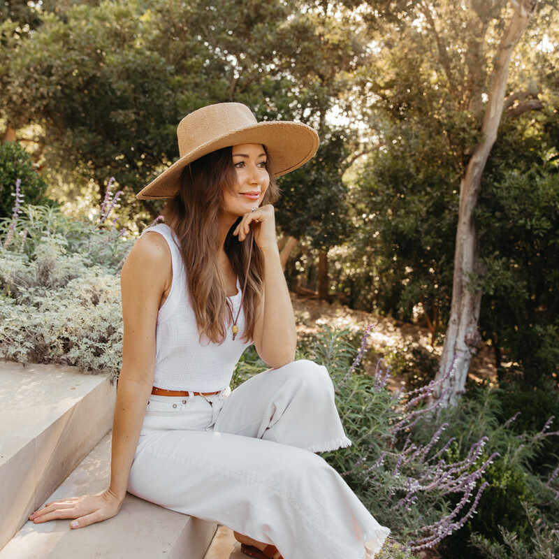 Camille Styles wearing sunhat.