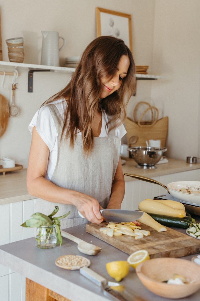 woman chopping in the kitchen