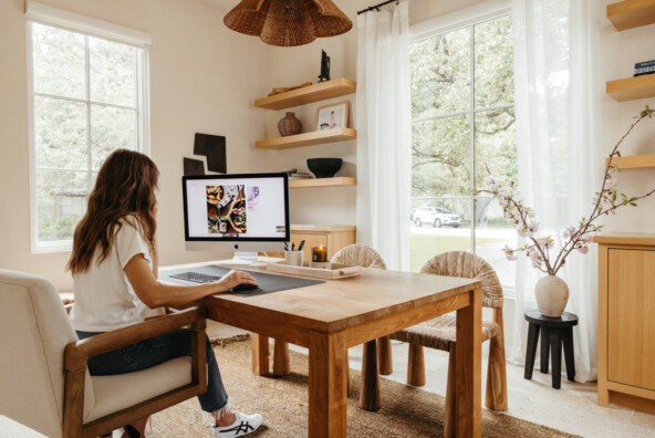 Camille Styles working at office.