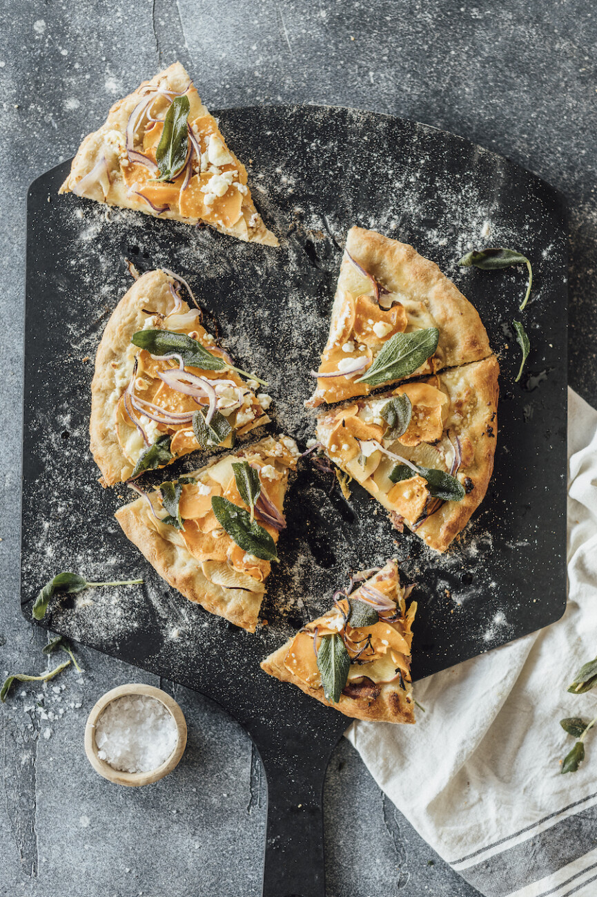 homemade fall pizza with sweet potatoes, apple, bacon and fried sage