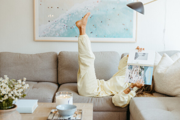 Woman reading on couch.