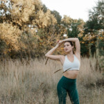 Woman stretching outside.