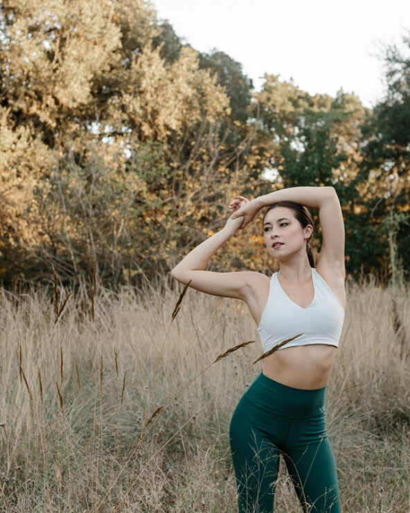 Woman stretching outside.