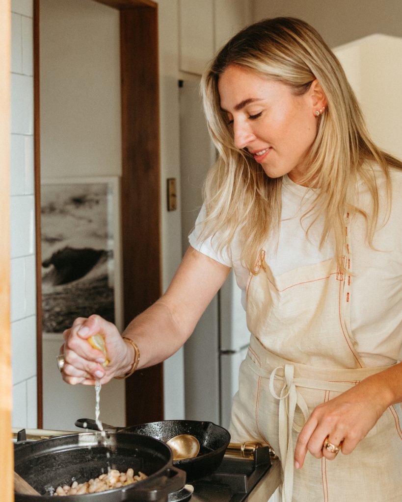 woman cooking over non-toxic cookware