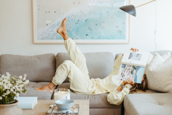 Woman reading on couch.