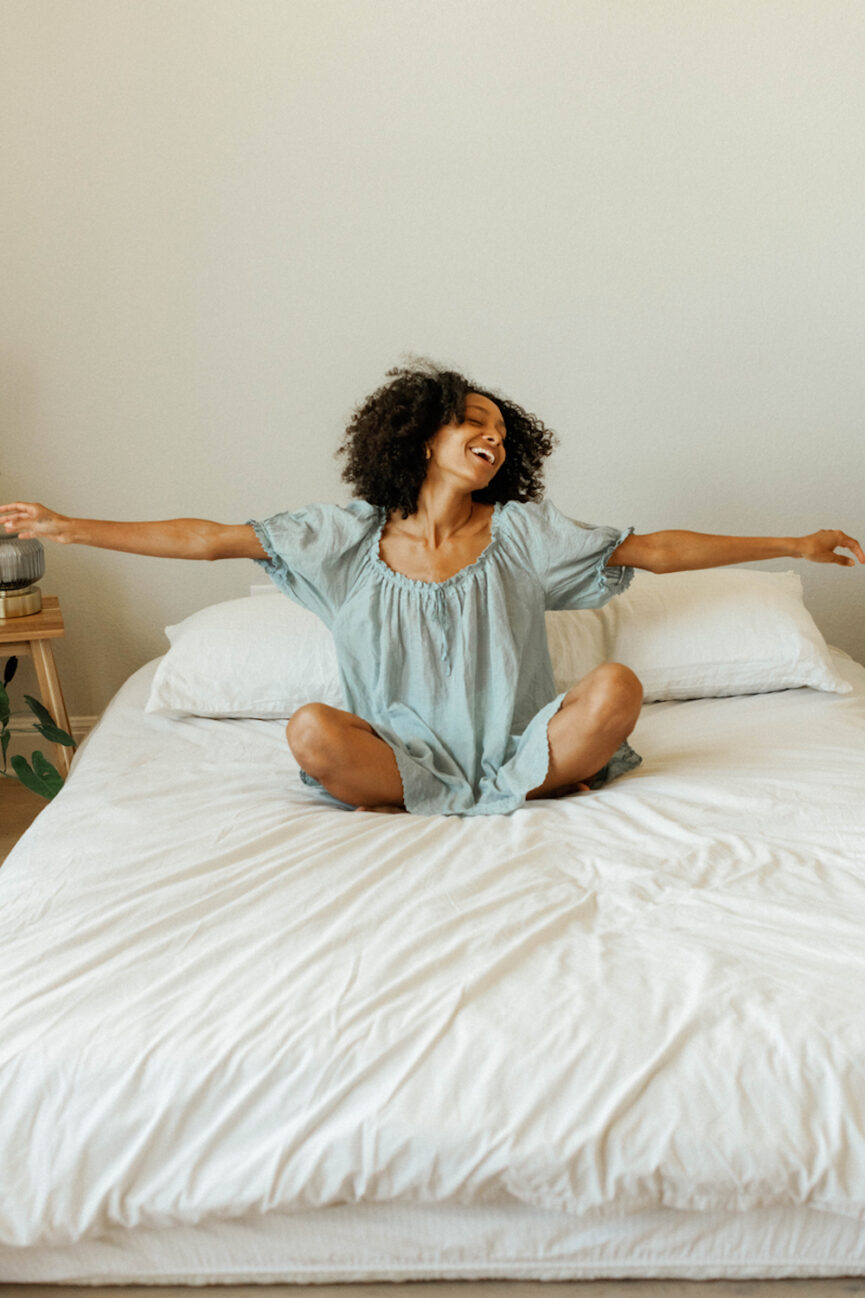 Woman laying on bed.