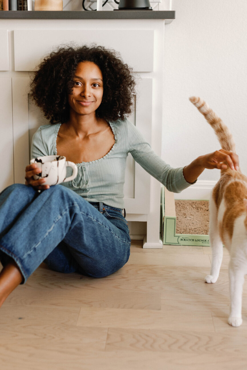 Woman petting cat.