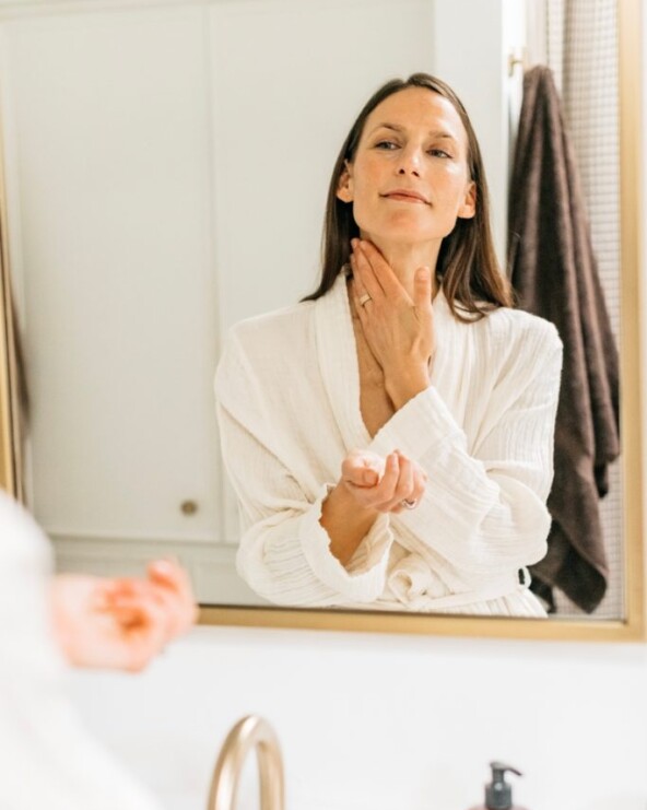 Woman washing neck.