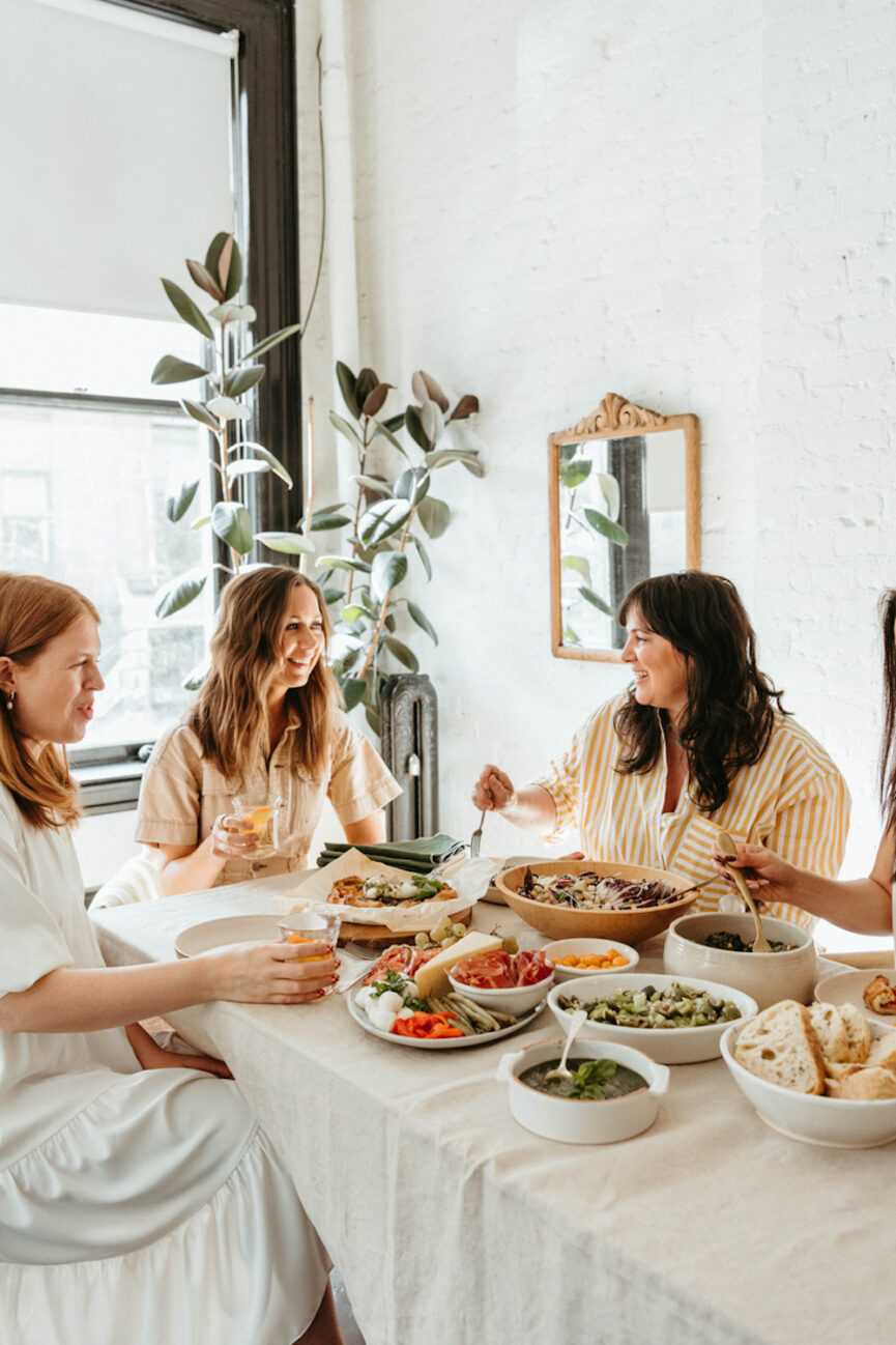 Woman eating at Galentine's Day party.